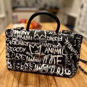Designer inspired graffiti bag with handles.